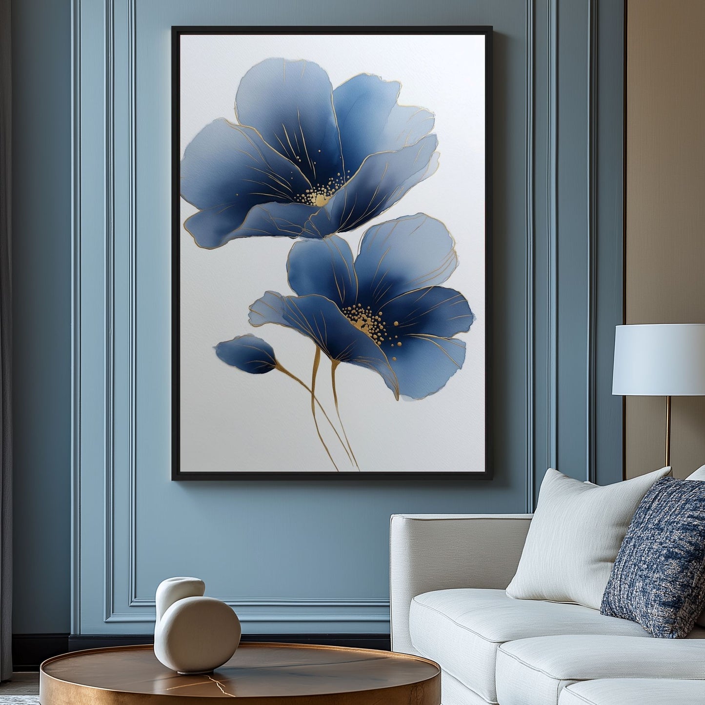 Blue floral artwork with two indigo blooms above a white sofa in a paneled blue living room