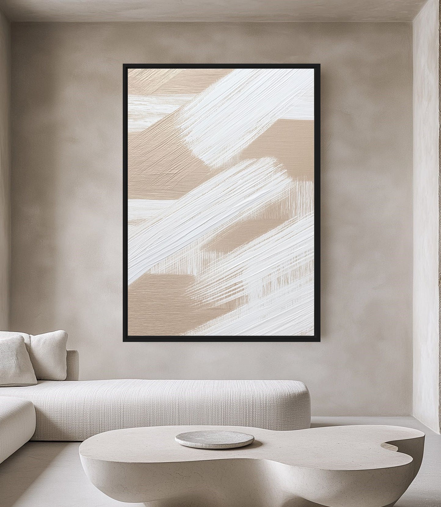Beige and white abstract brushstrokes above a curved cream sofa and low rounded table