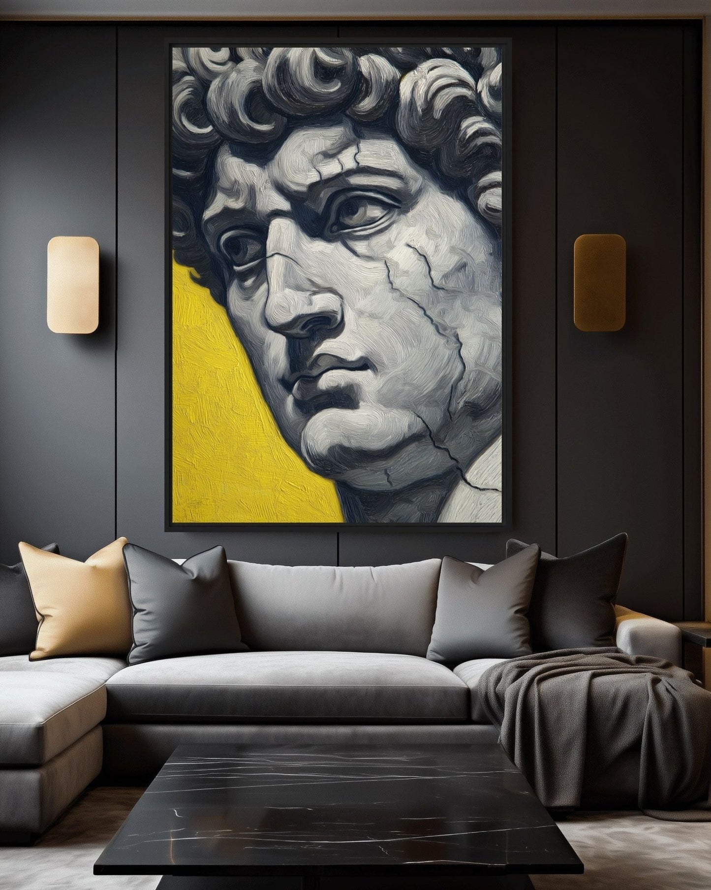 Gray portrait of Michelangelo's David against yellow, displayed above a gray sectional in a dark living room