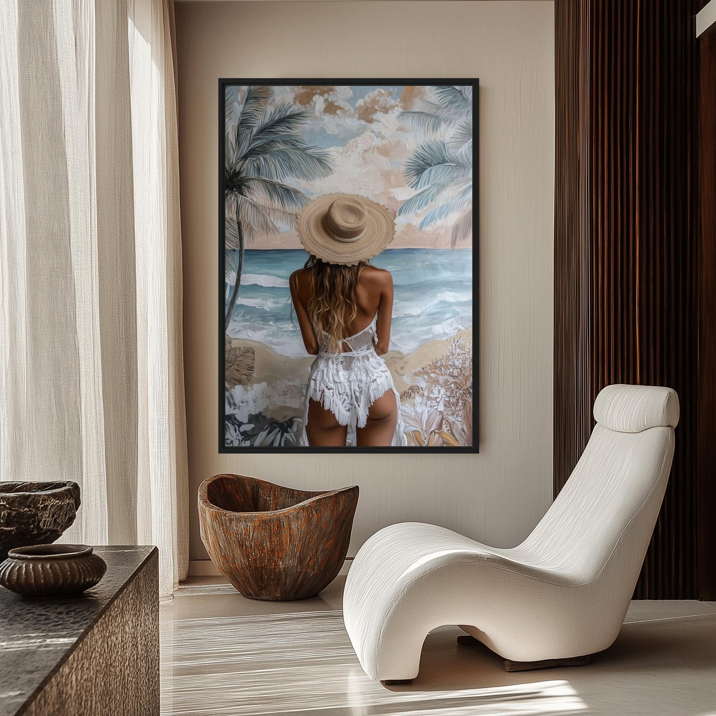 Woman in a sun hat facing the sea, displayed beside a white curved lounge chair and carved wood bowl