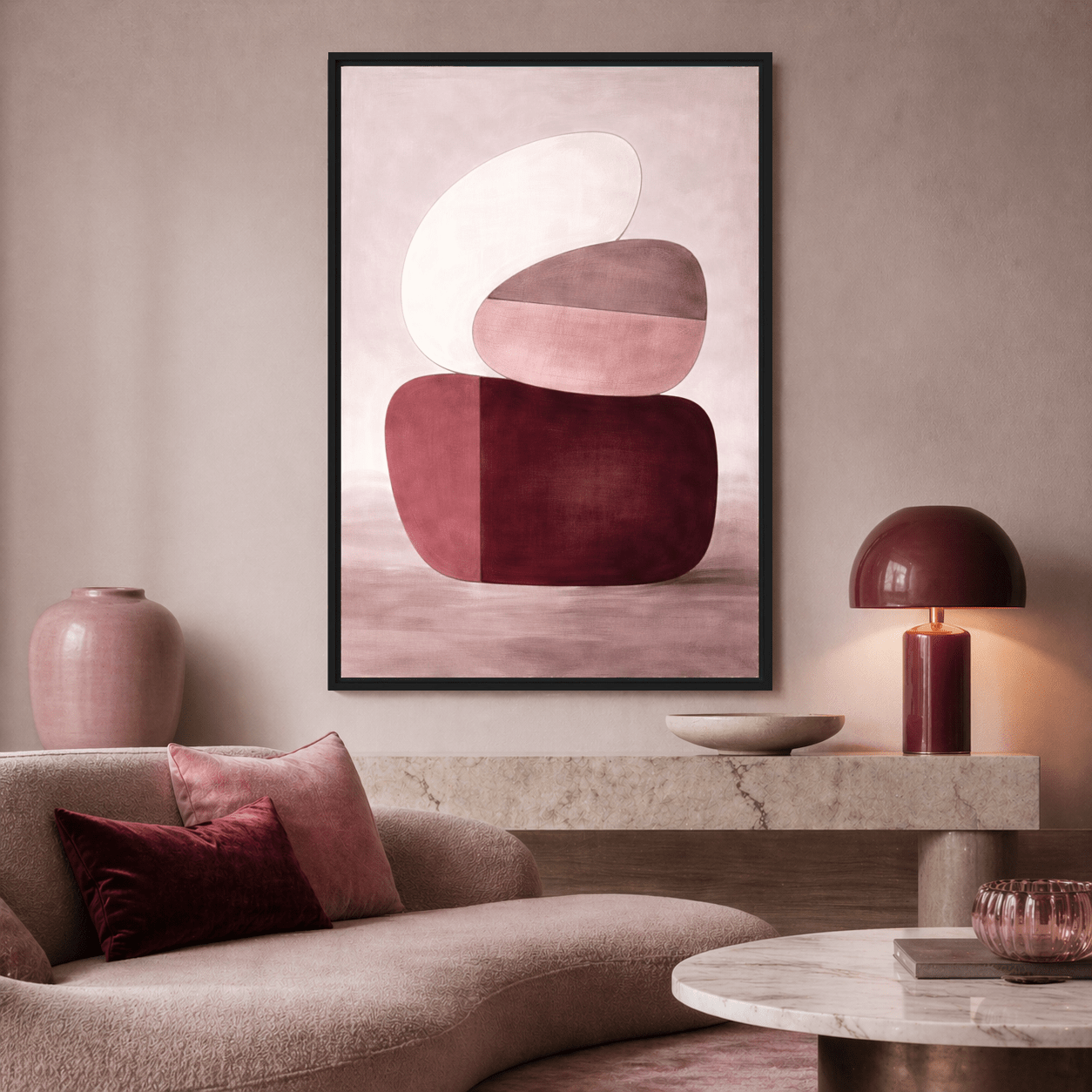Abstract Framed Canvas with stacked burgundy, blush and white shapes above a curved cream sofa