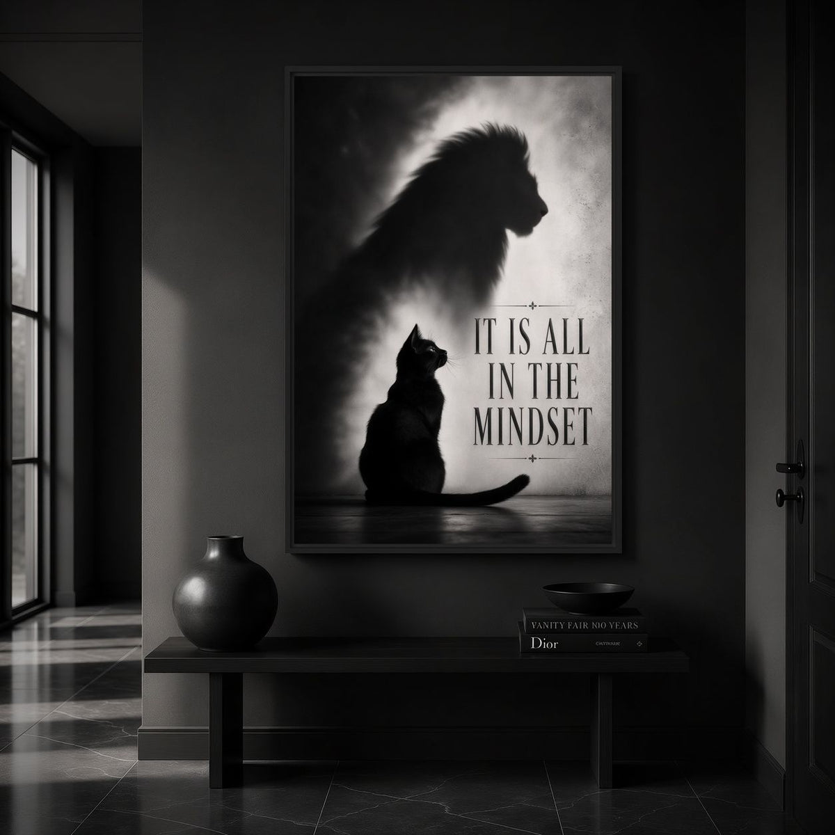 Motivational cat canvas above a dark console near tall hallway windows