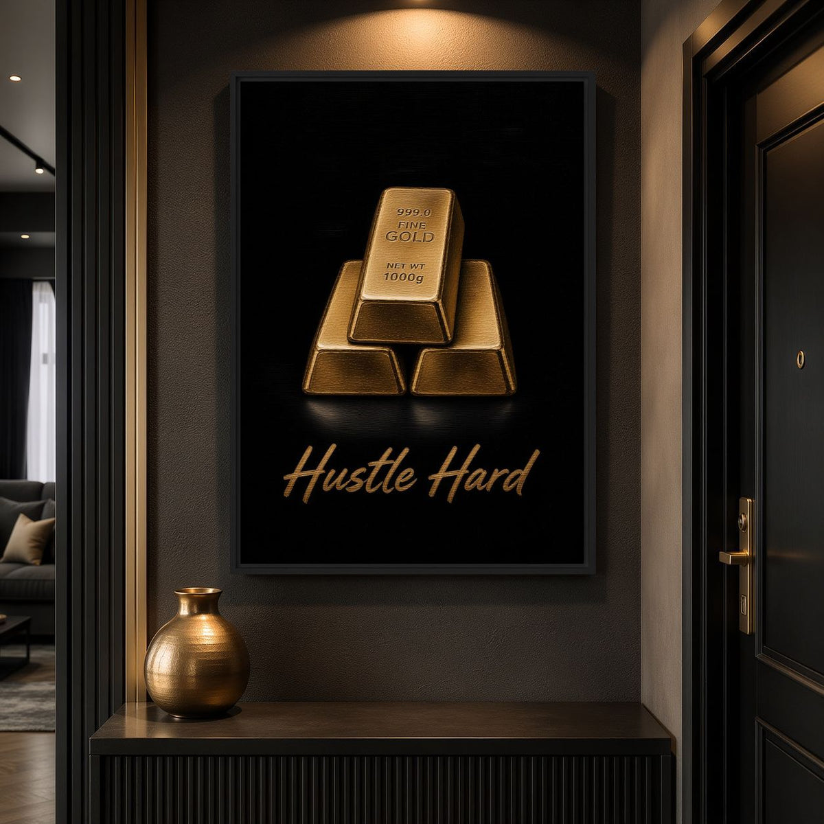 Gold-bar motivational canvas above a dark console and gold-toned vase