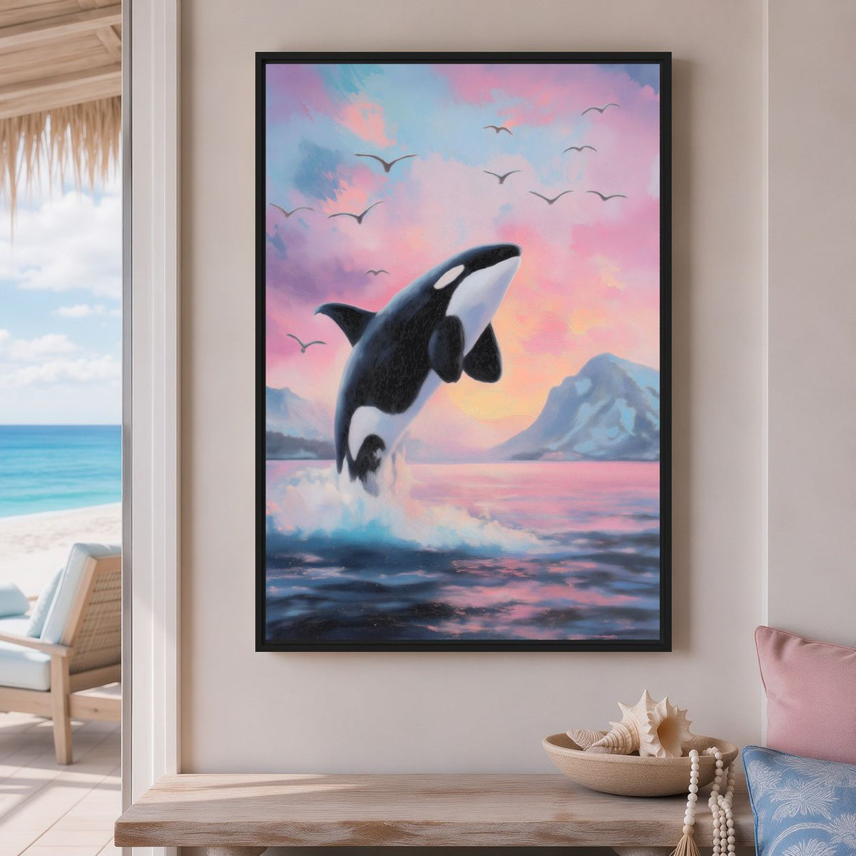 Orca canvas on a coastal room wall beside an open view of the sea