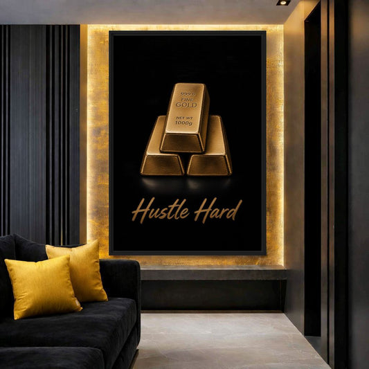 Hustle Hard gold-bar canvas beside a black sofa with yellow cushions