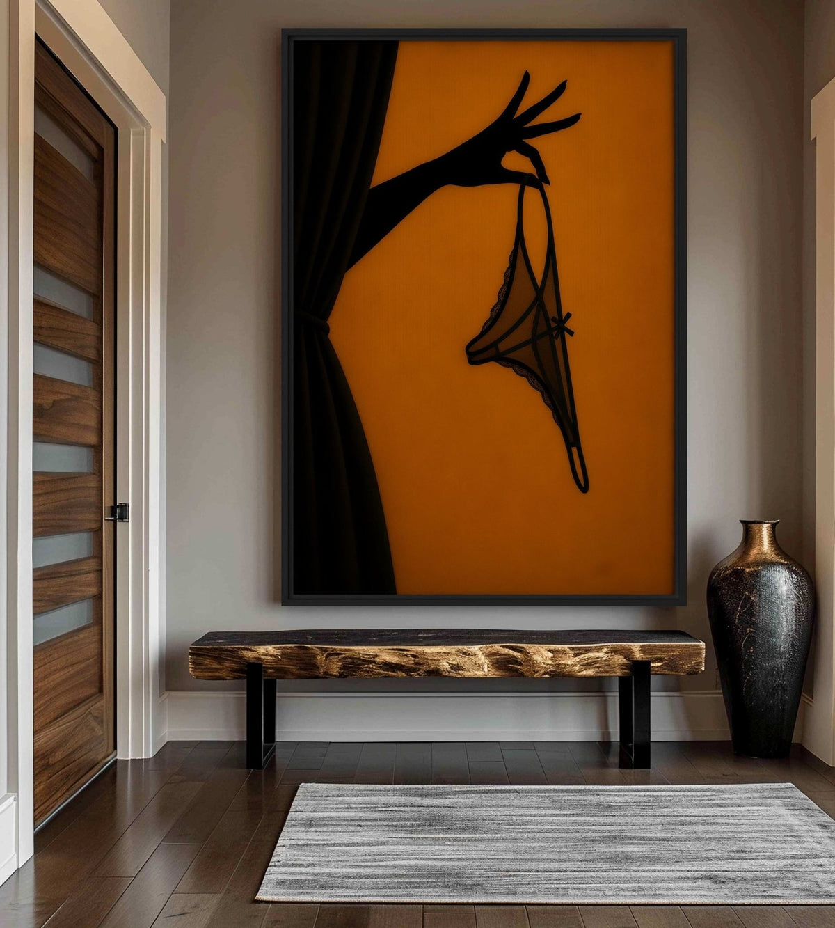 Amber and black lingerie artwork above a wood bench beside a tall vase