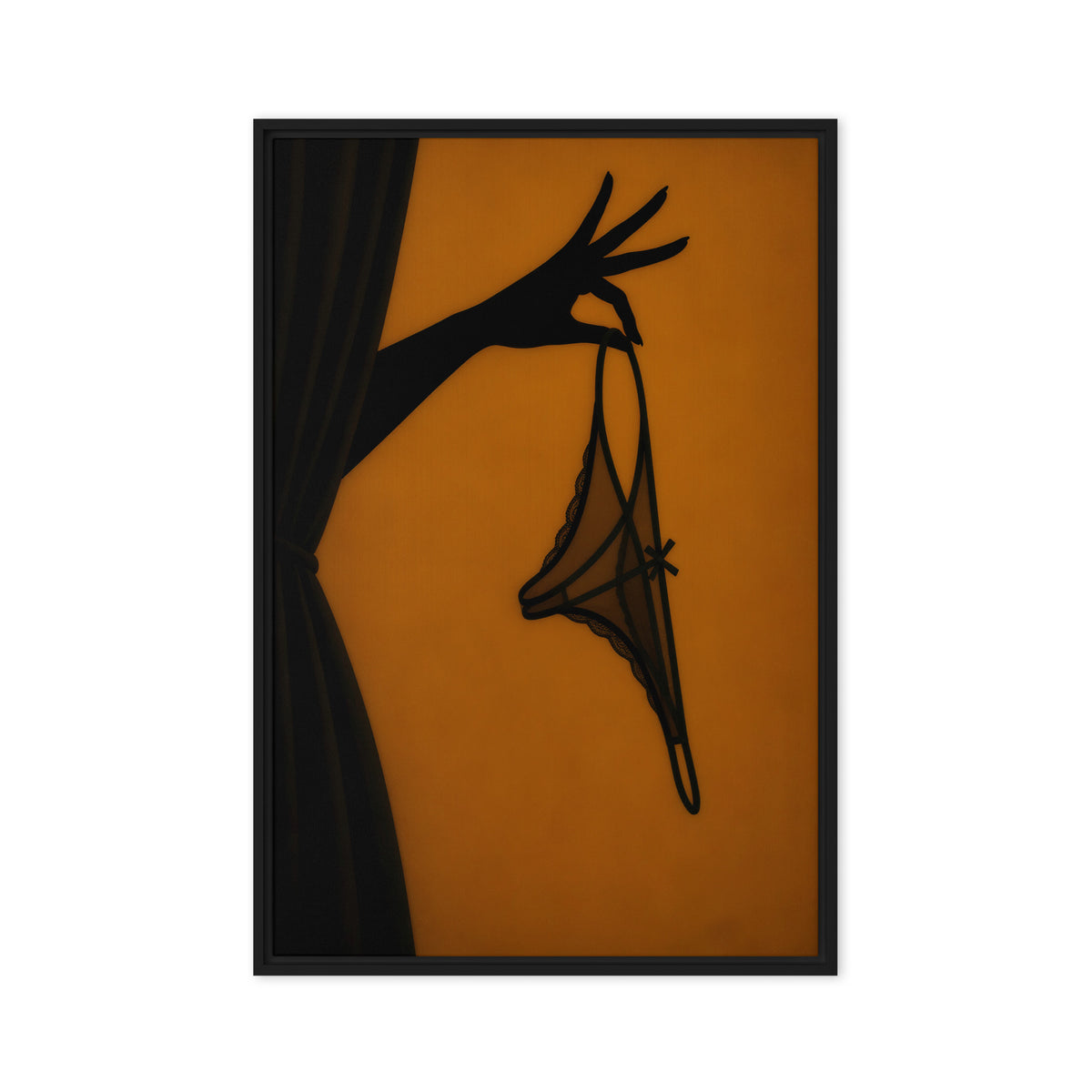 A black silhouette of a hand holds delicate lingerie against an amber-orange background; front view in a black frame, 20 x 30 in canvas