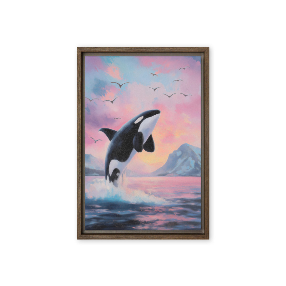 Leaping black-and-white orca above blue waves beneath a pink sunset sky, brown frame, 12″×18″ front view