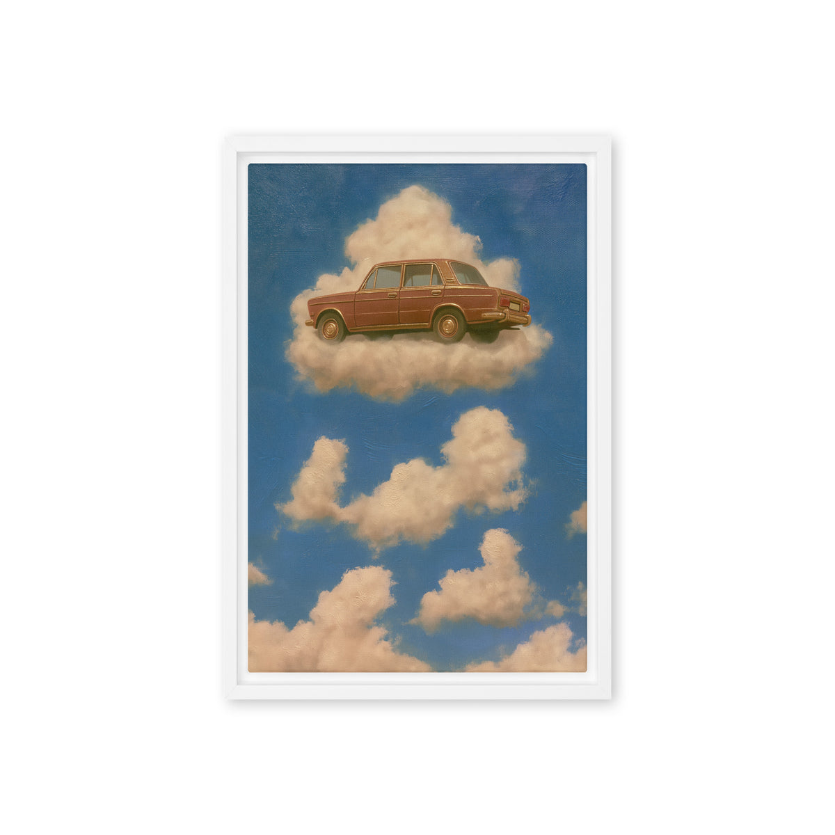 A rust-brown vintage sedan floats on a cream cloud in a blue sky; front view in a white frame, 12 x 18 in canvas